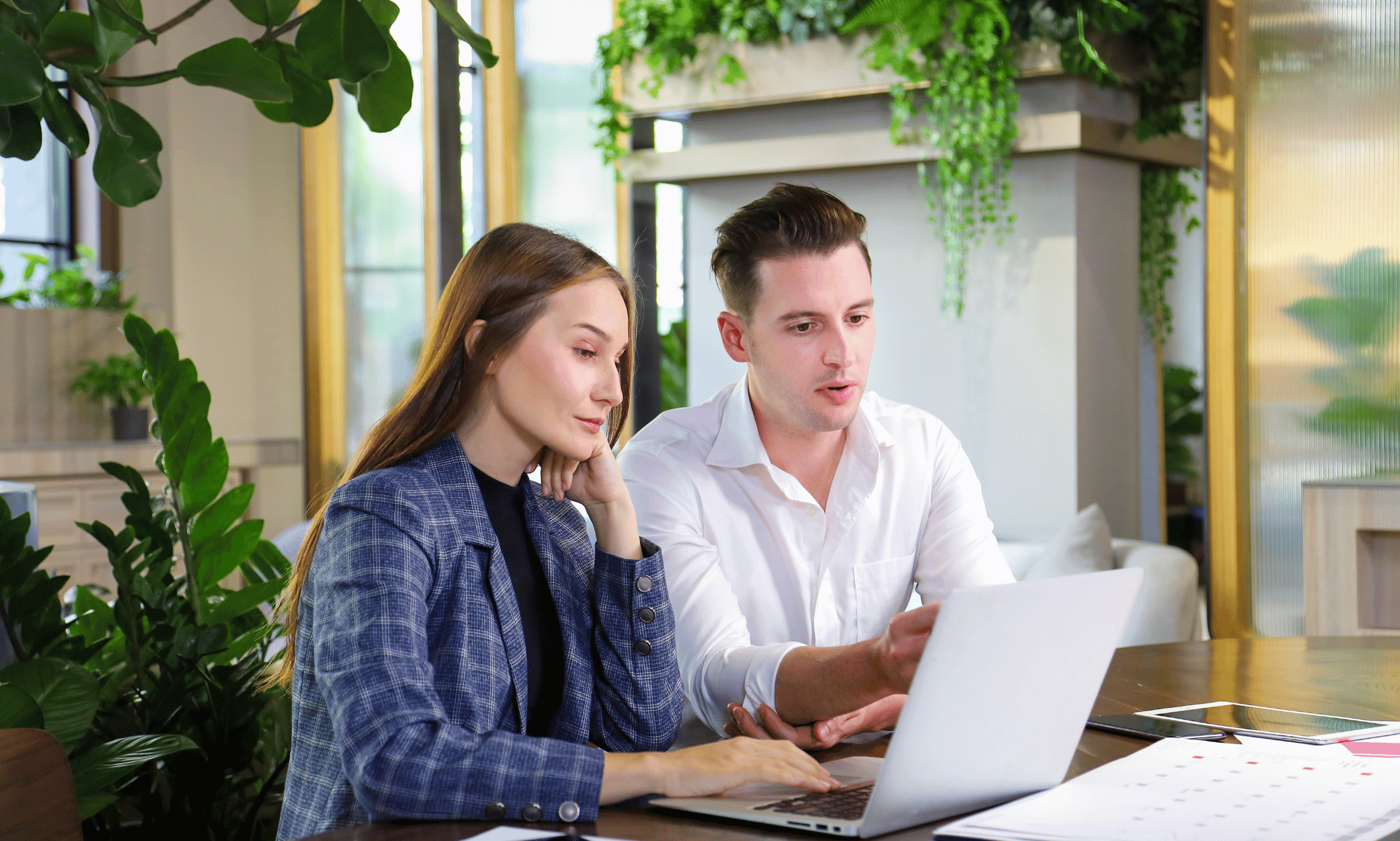 Two people looking at a computer
